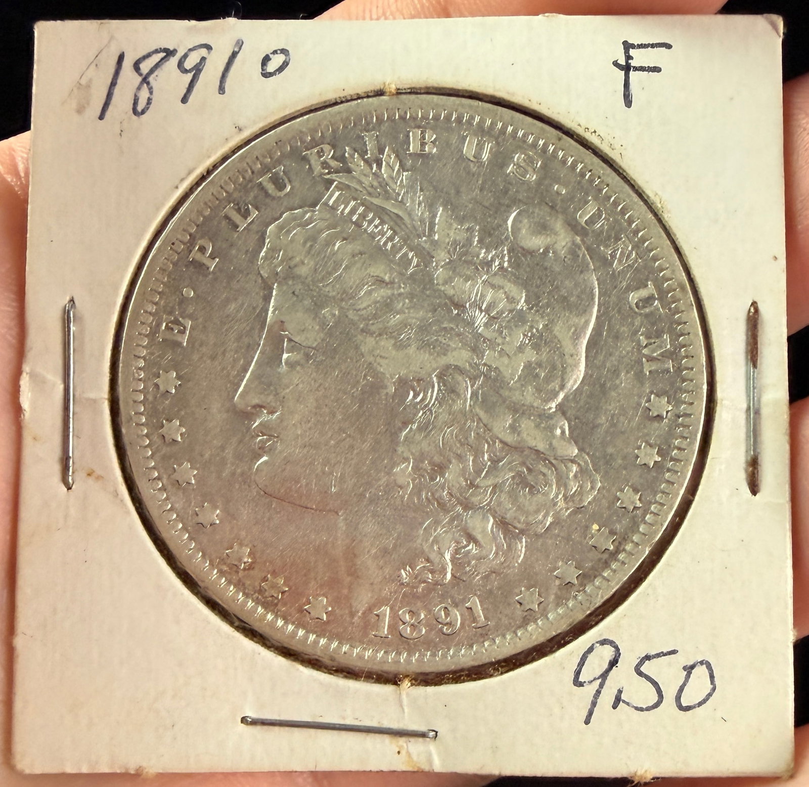 US 1891-O Morgan Silver Dollar: This US one dollar coin is a Morgan Silver Dollar dated 1891. It was struck at the New Orleans Mint, identified by the O mint mark located on the reverse, centered above the DO in DOLLAR (photo 3). Th