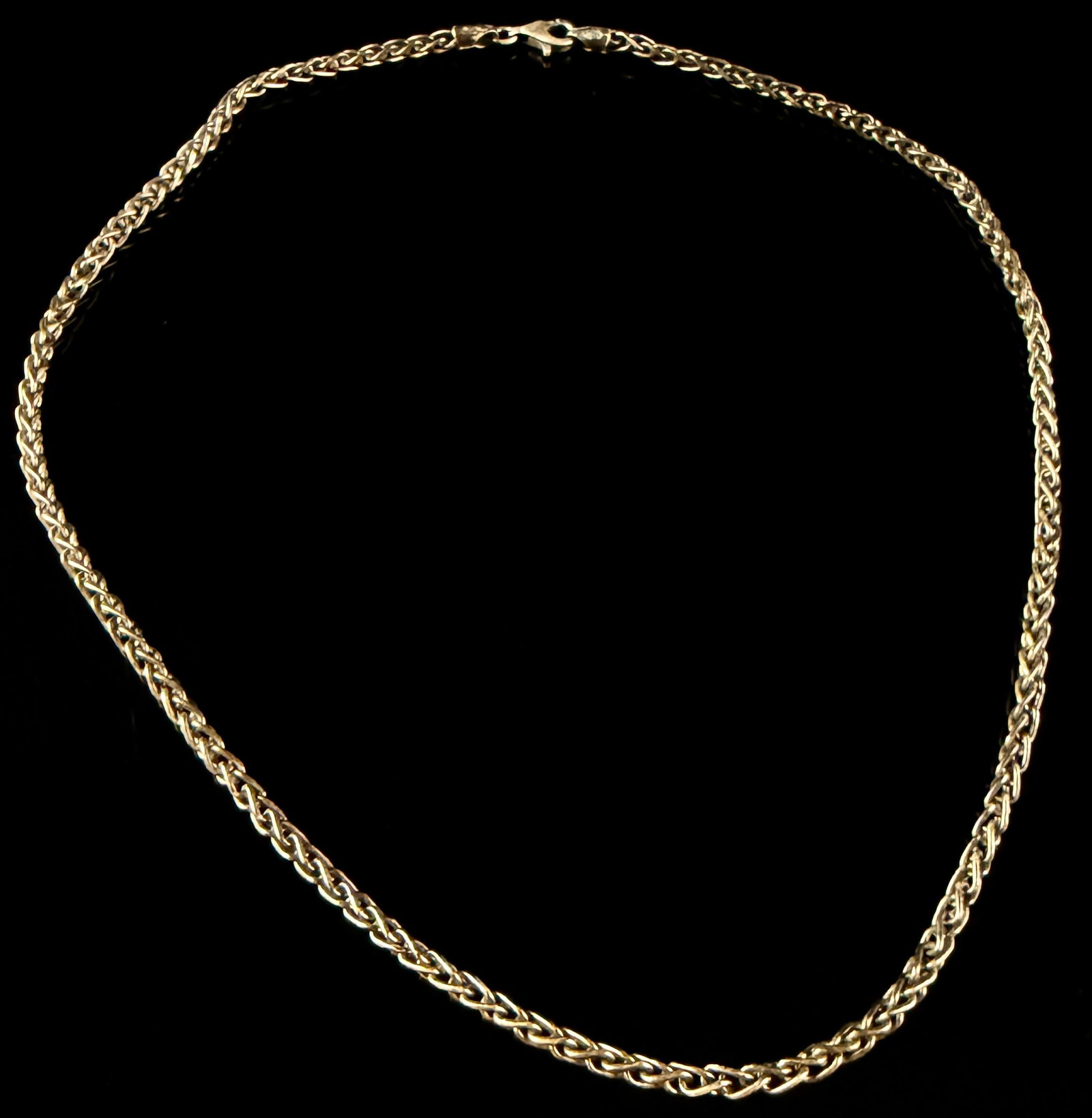 Sterling Silver Wheat Link Chain Necklace: A sterling silver chain necklace featuring a wheat link design, also known as a Spiga link, characterized by a four-sided braided construction. The piece is secured with a lobster claw clasp and featu