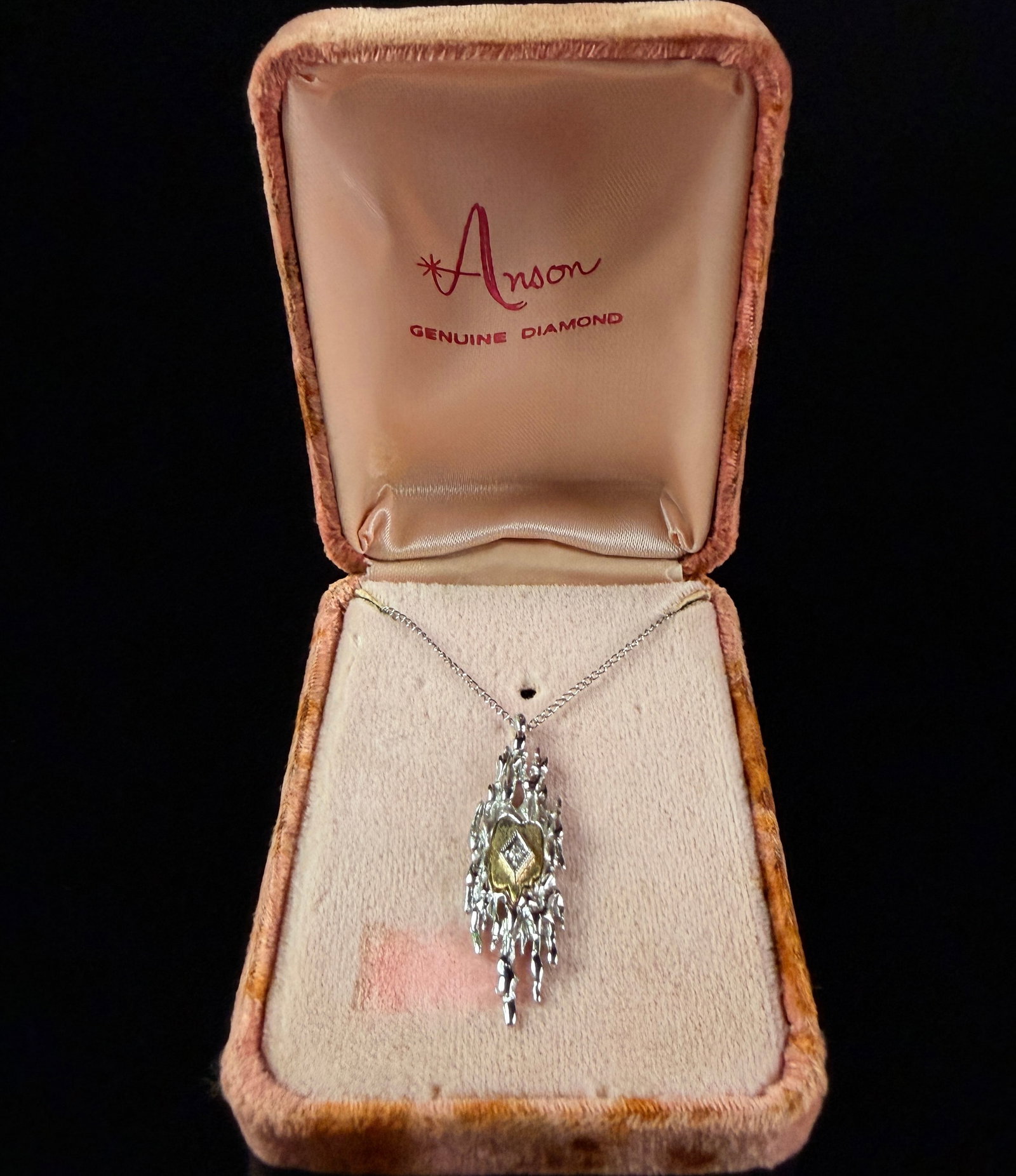 Anson Sterling Silver Modernist Pendant Necklace with Genuine Diamond: A vintage sterling silver pendant necklace in the Modernist style by Anson. The pendant features an abstract, elongated vertical form with a heavily textured Brutalist finish resembling molten or