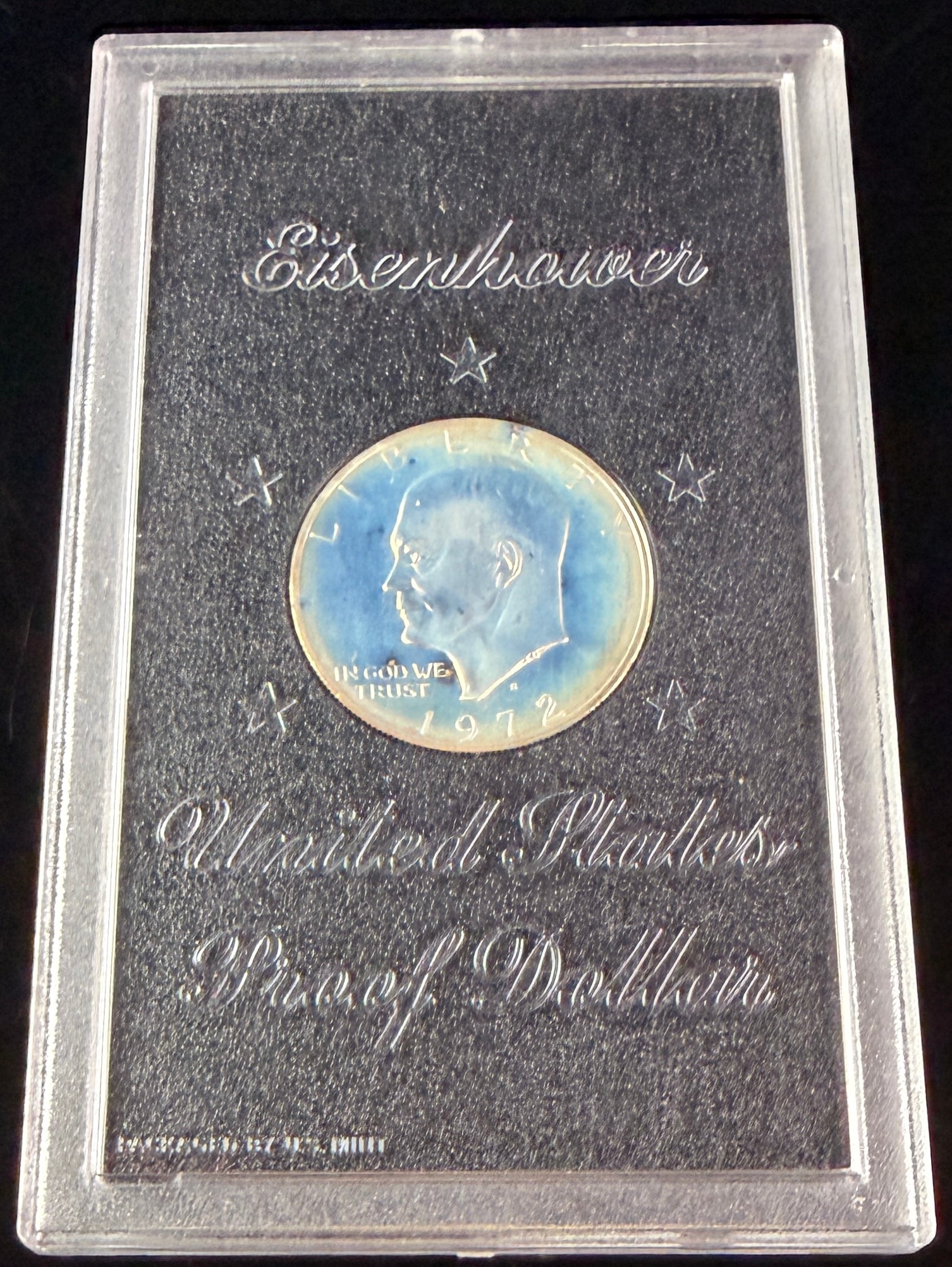 1972-S US Eisenhower Proof 40% Silver Dollar: A 1972-S US Eisenhower silver proof dollar, struck at the San Francisco Mint in 40% silver. The coin features the Eisenhower obverse and the Apollo 11 mission insignia reverse. The obverse displays th