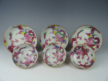 Sets of three cups and saucers: Three sets of Famille rose cups and saucers with dragon. Yongzheng 1723-1735. Cups= Height 5 cm, Diameter 9 cm. Saucer=Diameter 13,3 cm. Good condition. No chips, hairline or restoration.