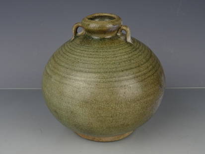 Porcelain Yue Kiln pot: Chinese porcelain celadon Yue kiln vase - 10th/11th century. Height: 17 cm. width 17 cm. A small restorations on the a ear.