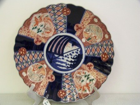 Antique Imari Charger: Handpainted 18 1/8" diameter with cranes in blue, rust green & golden colors.