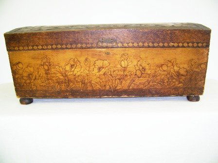 Early 1904 Pierced Carved Folk Art Trunk: Super early 1904 folk art trunk, crafted with a dome top, pierced or burnt etchings with floral design to base. Looks to be a crest on top. Burnt into wood on interior reads: H.A. Morse 1904. All orig