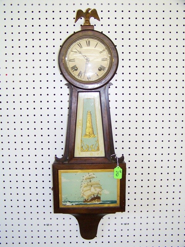 Early Eagle Top Banjo Clock 33" Tall: With sailing ship and light house. 10 1/4" wide.