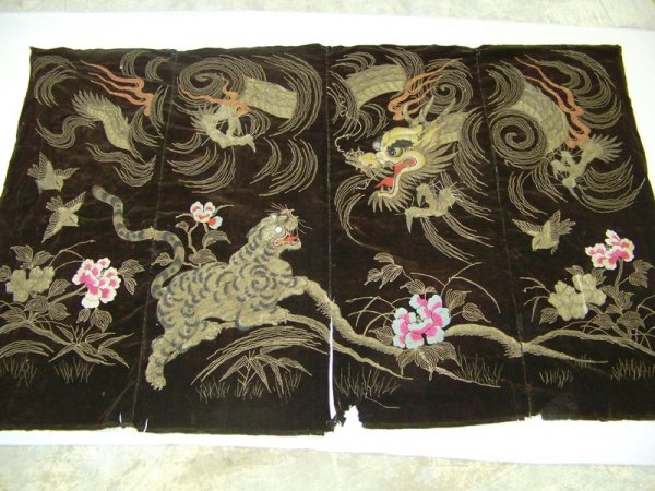 19th C. Oriental Tapestry: 19th C. Oriental hand woven tapestry 50" x 77" consisting of 4 panels sewn together. It has dragon and tiger motif with silver and gold threads with glass eyes in the animals