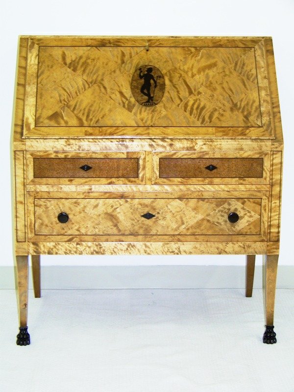 Early Biedermeier Style Inlaid Dropfront Desk: Of mixed woods of great inlaids and great Ebony inlaids. With 3 drawers to base with 2 hidden drawers,With a birds eye maple style inteior with small drawers.Great Pc.Resting on pair of wooden carved 