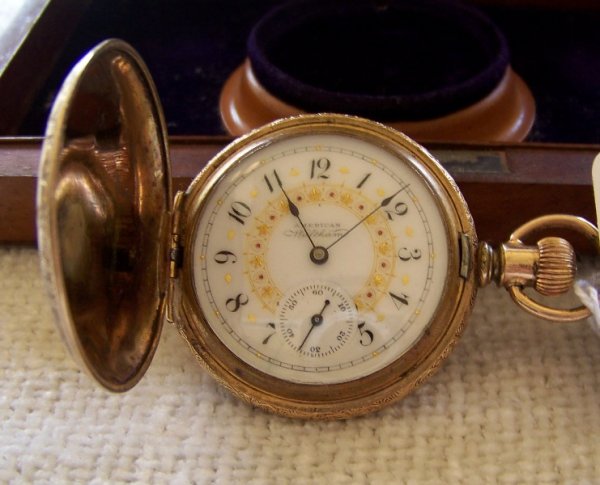 American Waltham Jeweled Pocket Watch: With porc. & jeweled face & gold stars,Saftey Barrel, has second hand dial.Engraved Ninna to Grace. App. 1 5/8" round.Case # 2266465, watch movement # 5766400