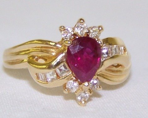 Tiffany & Company 14kt Ruby & Diamond Ring: Set in 14kt yellow gold,Ruby app. 1ct with original tiffany box.