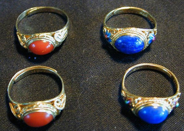 4 STERLING VERMEIL LAPIS & RED CORAL RINGS: a. 2 set w/ oval lapis w/ enamel design. b. 2 set w/ oval red coral.