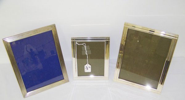 3 Christofle Silver Picture Frames: Pair of matching frames ,one is 11" x 8 3/4" wide,other is 8 3/8" tall x 6 3/8" wide. Other frames is 10 7/8" tall 8 1/2" wide.All stamped Made in Italy with Magh. Wood on backs.