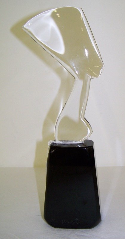 Signed Dante Marioni Art Glass Sculpture: Thin glass lady on thick base 11" tall base at widest point is 2" . Signed on side M Dante.