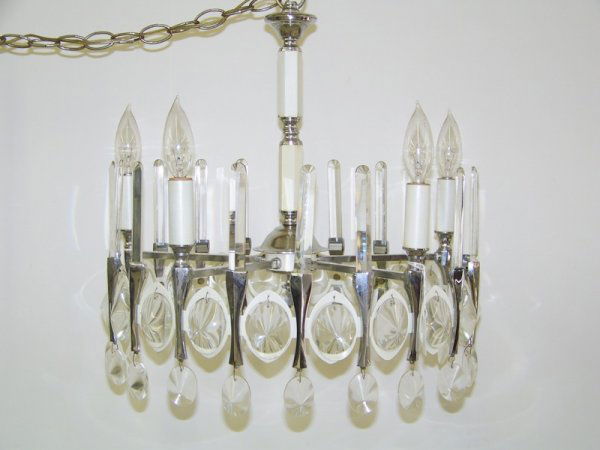 Mid C. Modern Chrome & Crystal Chandlier: Great chandlier with oval prisims around outer rim and round top crystal prisims going up ( missing one prisim ),Hangs app 19" app. 17" across.