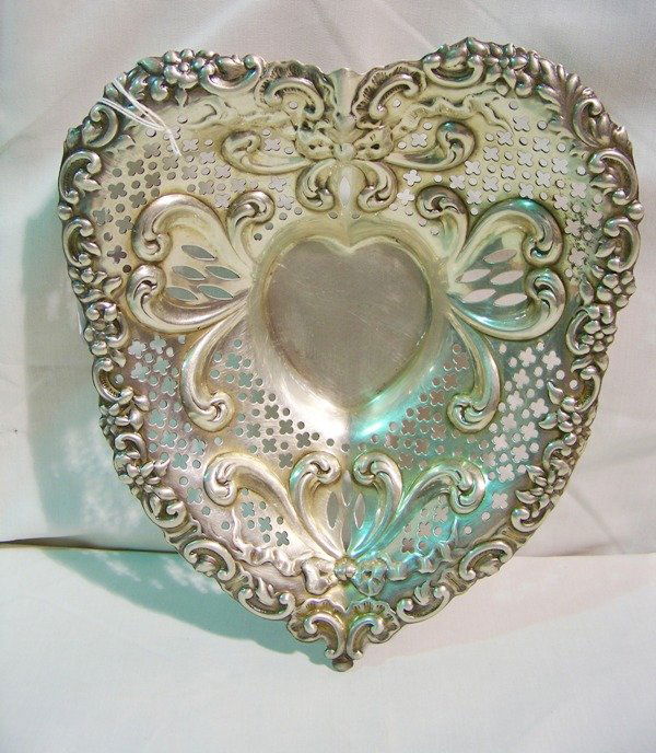 Large Gorham Sterling Pierced Heart Shaped Bowl: Great sterling bowl shaped in the form of a heart. 9 3/4" long 8 1/4" wide resting on 3 round bun feet. 10.6 oz's