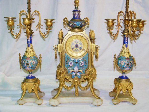 19th C. French Champleve Clock & Candelabra's: Great Dora Bronze and Champleve clock and candelabras all on marble bases. Clock stamped on inside of what looks to be JapT Freres G Med. D'Honn.Clock is app. 21" tall 8" wide and app. 5" deep with ma