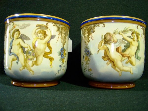 Pair 19th C. Hand Painted KPM Cashe Pots: Pair of great KPM cashe pots handpainted with cherebs and florals.In great condition. Stands 6 3/4" tall and 7 1/8" across top.