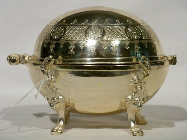 Reed & Barton Silver Covered Butter Dish: Reed & Barton Silver Covered Butter Dish, Oval in shape with roll top dome. Has center insert also, stands app. 5 1/2" tall and 7" wide resting on 4 hairy paw feet. On base it says plated by Reed & Ba