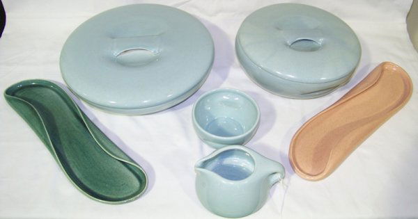 8 Serving Pc's of Russel Wright China: 8 Serving Pc's of Russel Wright China, 2 - 13" long trays , 2 part stacking creame & sugar ,10 1/2" covered server & 8 3/8" covered server.