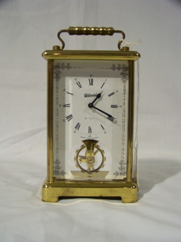 Vintage Brass Colonial Carriage Clock: Vintage Brass Colonial Carriage Clock. Colonial 8 day , made in West Germany. Stamped on back of clock Aug.Schatz & Sohne. Stands 6 1/4" tall