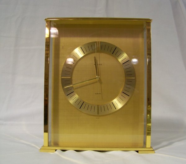 Vintage Brass & Glass Relide Carriage Clock: Vintage Brass & Glass Relide Carriage Clock with a Quartz movement. Standing 8 1/4" tall 6 7/8" wide 2 3/4" deep.