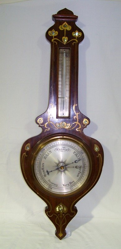 Early Brass & Mother Pearl Inlaid Barometer: Early Brass & Mother Pearl Inlaid Barometer. Banjo style and is app. 34" long app. 11 3/4" wide in a Maghy. case.