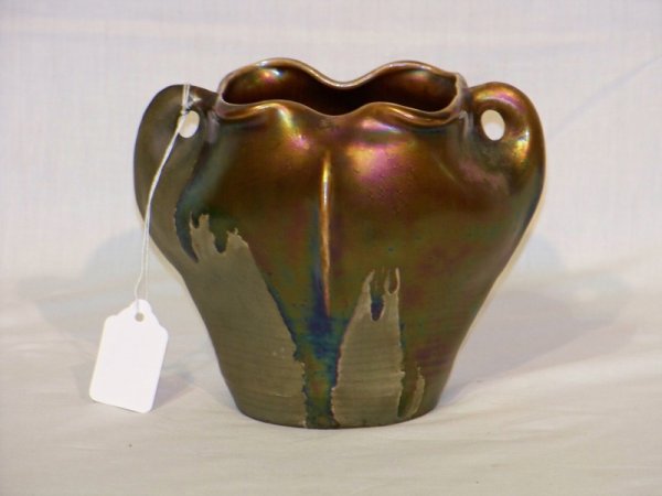 Art Nouveau Amphora Handled Vase: Art Nouveau Amphora Handled Vase . Standing 5 1/4" tall and app. 6 1/2" wide. With double handles and a green a purple iridescent glaze. Numbered on base.