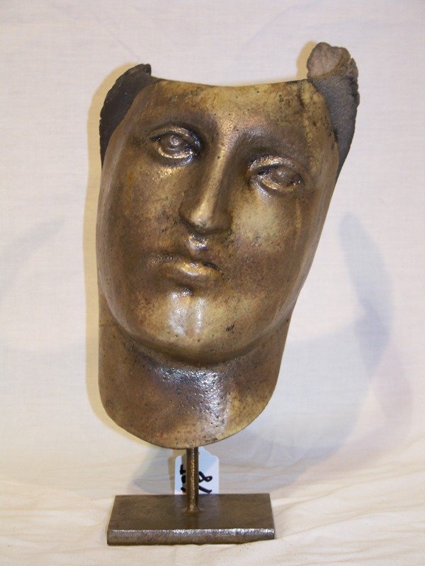 Vintage Signed Pottery Face Sculpture: Vintage Signed Pottery Face Sculpture resting on a steel base. Signed on back , Stands app. 11 3/4" tall and app. 7" wide