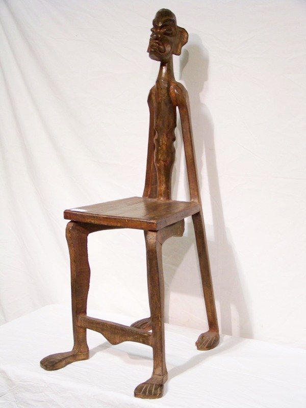 African Carved Wood Figural Footed Chair: African Carved Wood Figural Footed Chair. 43" h x 18" d x 16" w