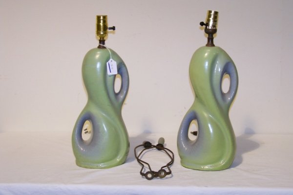 Pair 1950's Modern Free Form Pottery Lamps: Pair 1950's Modern Free Form Pottery Lamps , in a green color and standing app. 17" tall. Has harps now not attached to lamp.