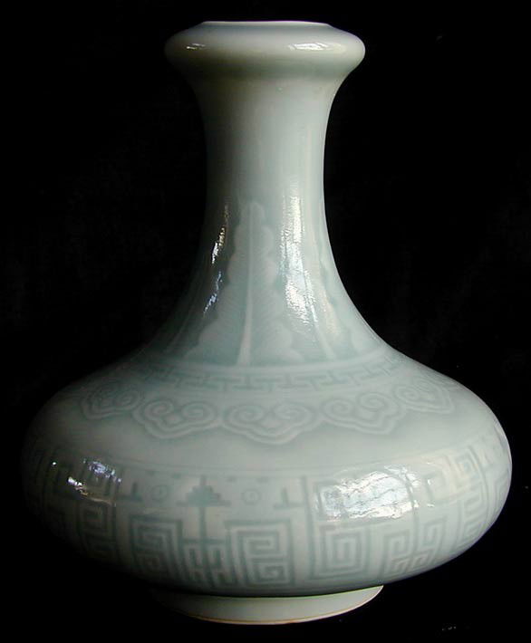 ANTIQUE CHINESE VASE W/ QIANLONG SEAL: Pale blue color glazed vase w/ lotus leaf design, Qianlong seal in underglaze blue, 6"H.