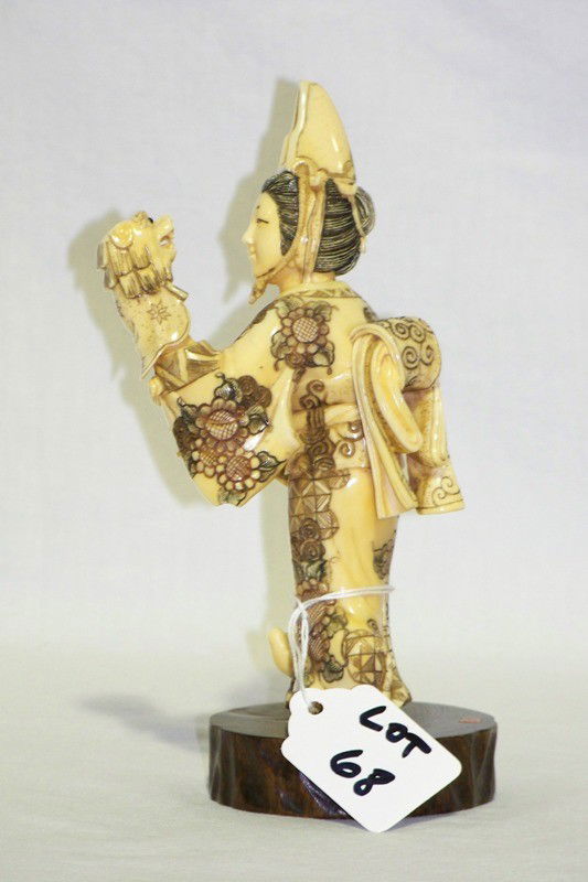 Signed Chinese Polychromed Ivory Female Puppeteer: Signed Chinese Polychromed Ivory Female Puppeteer with foo lion puppet on hand , signed in red plaque on base, figure si 6 1/4" tall on base is app. 7" tall. Will not ship international.