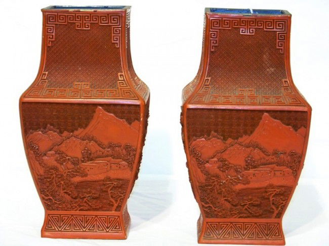 Pair Early Chinese Style Cinnabar Landscape Vase's: Pair Early Chinese Style Cinnabar Landscape Vase's. Has design of Mountians and village on one side other has Bridge and tower and trees. Both with greek key boarders. Both stand app. 11" tall and 6"