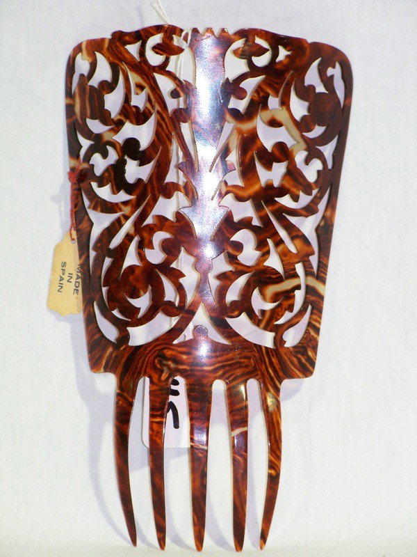 Early Tortoise Shell Hair Comb : Early Tortoise Shell Hair Comb , Has original paper tag that states Made in Spain.7" long and 4" wide.