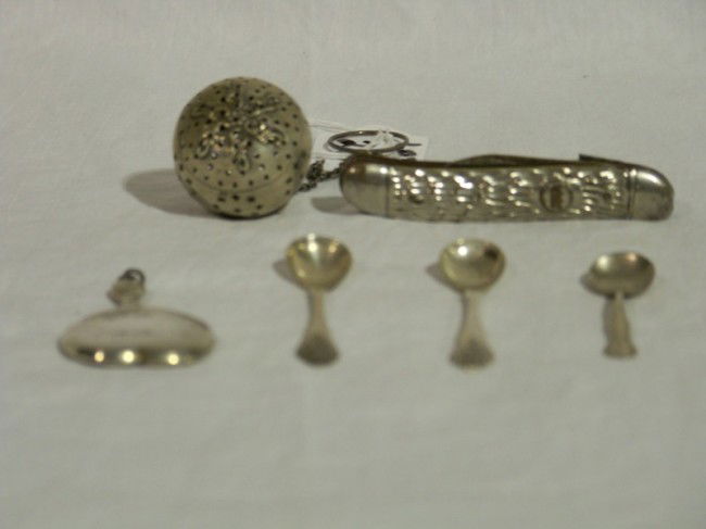 6 Pc. Silver Group: 6 Pc. Silver Group , 3sterling salt spoons , sterling small hand mirror and sterling tea ball, and knife.