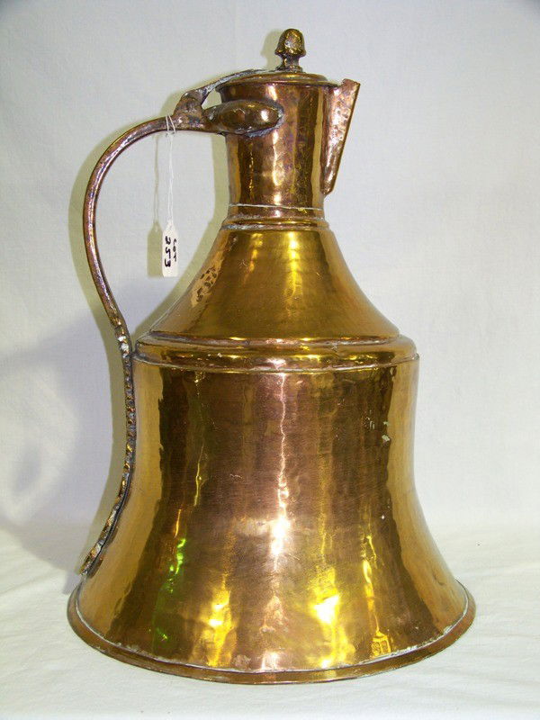 Massive Vintage Hand Hammered Copper Waterpitcher: Massive Vintage Hand Hammered Copper Waterpitcher with large handle. Stands app. 18" tall and 13" across base.
