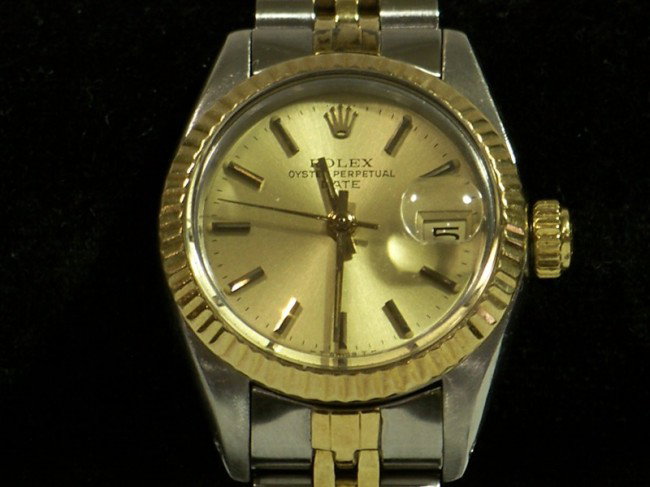 Ladys Rolex Oyster Presidential Wrist Watch: LADIES ROLEX WATCH. Rolex Oyster wrist watch with two tone jubilee band and gold face. Marked "Rolex Oyster Perpetual".Given as a Christmas gift to his wife from Edwin Jay Gould on 12/25/81, Size clos