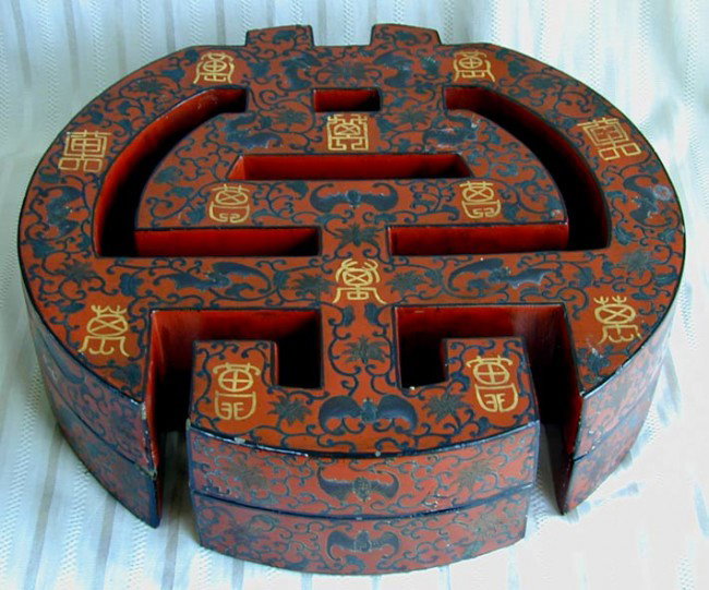 ANTIQUE CHINESE LACQUER COVERED BOX: Early 20th C. Chinese hand painted lacquer box w/ cover in the round shape of symbol Shou with 12 caligraphy symbols and bats. Size: 20 1/2" diameter x 5 1/2" High. Good condition. Being resold for no