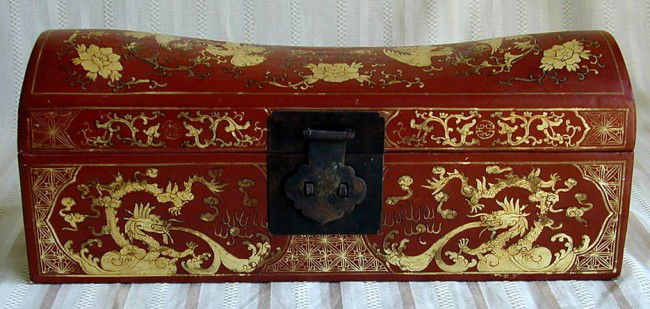 ANTIQUE CHINESE RED LACQUER DOMED DOCUMENT BOX: A Chinese red lacquer double-domed document box with gilt 5-clawed dragons & flaming pearl, clouds, phoenix & floral design; metal hinges & handles, the sides decorated with the Shou symbol, 16.5"L x