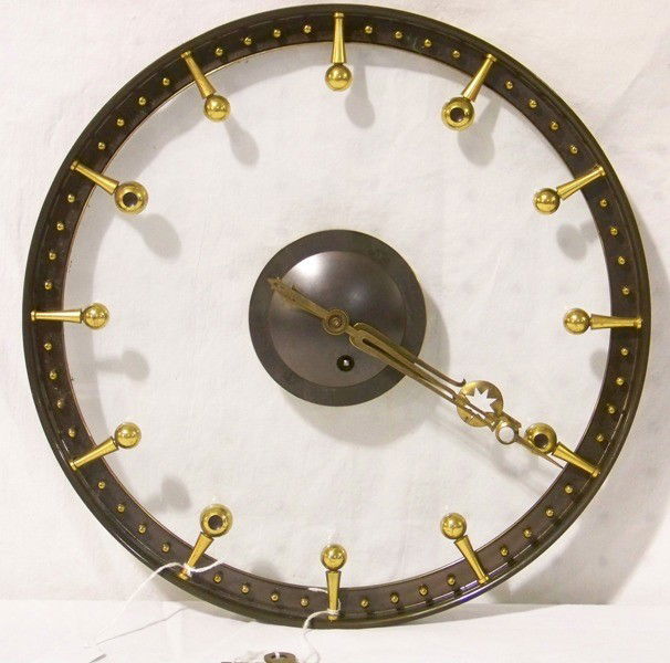 Kienzel Art Deco Bronze & Glass Wall Clock: Kienzel Art Deco Bronze & Glass Wall Clock. Great clock in working condition. In a bronze or brass outer edge with bronze or brass numeral and second markers, interior is glass with original label on