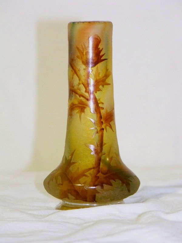 Early Signed Daum Nancy Vase W/ Cross of Lorraine: Early Signed Daum Nancy Vase W/ Cross of Lorraine. Great vase with flowers and leafs. Signed Daum Nancy with the Cross of Lorraine. Stands 4 1/2" tall and app. 2 1/4" wide at it's widest point.