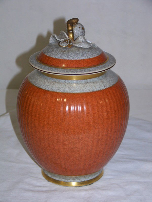 Vintage Royal Copenhagen Fruit Top Lidded Temple J: Vintage Royal Copenhagen Fruit Top Lidded Temple Jar. In a burnt orange and crackel glazed with gold trim and stands app. 10" tall app. 6" wide.