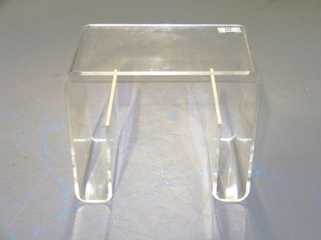 Modern Lucite Low Table with Book Shelfs: Modern Lucite Low Table with Book Shelfs. Made out of one pc. of lucite . 19" long 12" wide and 16" tall.