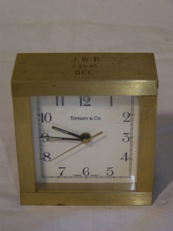 Vintage Tiffany & Co. Brass Desk Alarm Clock: Vintage Tiffany & Co. Brass Desk Alarm Clock. Engraved on top JWB 3-28-85 QCC. 3 3/8" tall 3 1/8" wide and 1 3/8" deep.