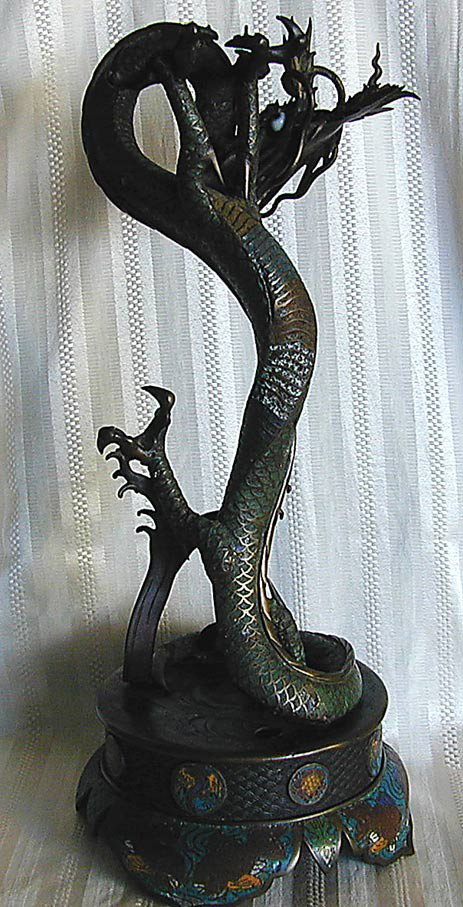 ANTIQUE CHINESE BRONZE & CLOISONNE DRAGON: An impressive antique Chinese bronze and champleve cloisonne enamel 3-toed dragon mounted on a bronze and cloisonne base, glass eyes; impressed seal on underside of base, 20"H, drill marks.