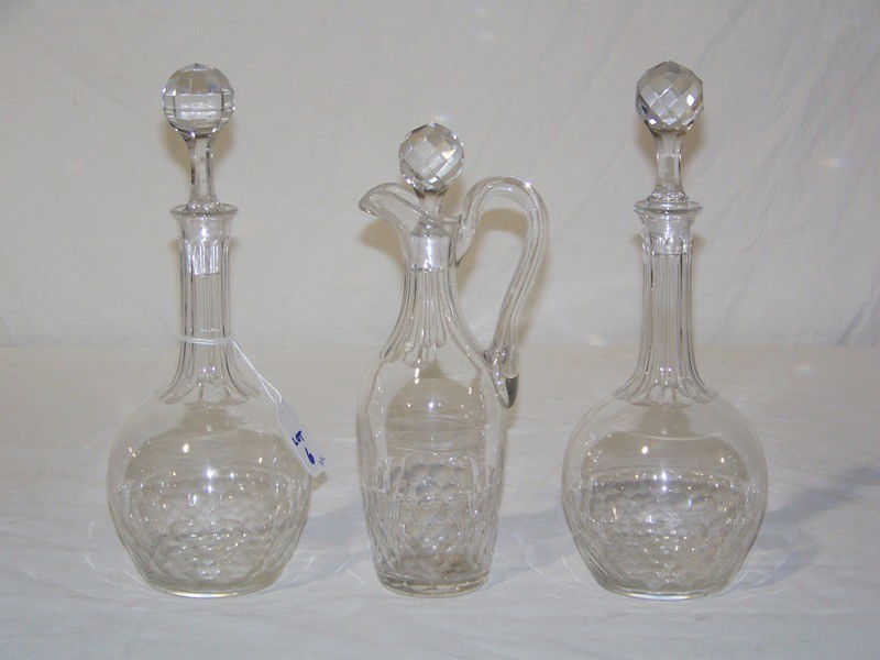 2 Vintage Baccarat Decanters & Curet: 2 Vintage Baccarat Style Decanter & Cruet. All are hand cut with thumb print design. Decanters are app. 10 1/2" & 10 1/4" tall, cruet is app. 9" tall.