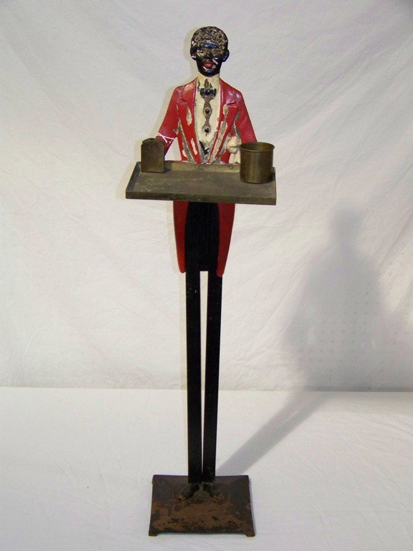 Early Iron African American Figural Smoke Stand But: Early Iron African American Figural Smoke Stand Butler. Great piece of Americana with African American butler holding smoking tray with match and cigarettte holder. Stamped on back " patent applied fo