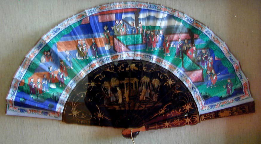 ANTIQUE CHINESE LACQUER & PAINTED FAN: A finely painted antique Chinese paper fan mounted on gilt lacquer wands, the paper scene shows a large court scene, the fan is now mounted and nicely preserved in a shadow box frame measuring 19.50"H