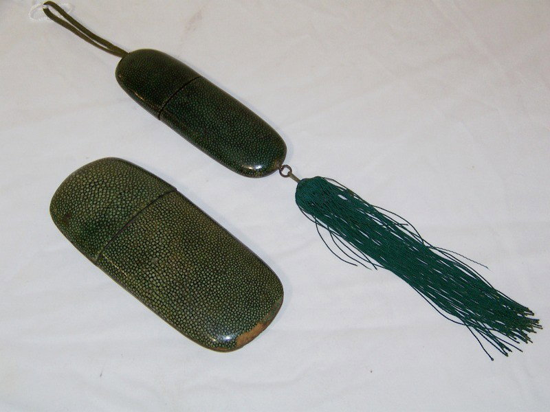 Pr. ANTIQUE CHINESE SHAGREEN SPECTACLE CASES: Pr. ANTIQUE CHINESE SHAGREEN SPECTACLE CASES. Largest case is app. 6 1/2" long and 2 3/4" wide,other narrow one is app. 5 1/2" long with fringe and handle.