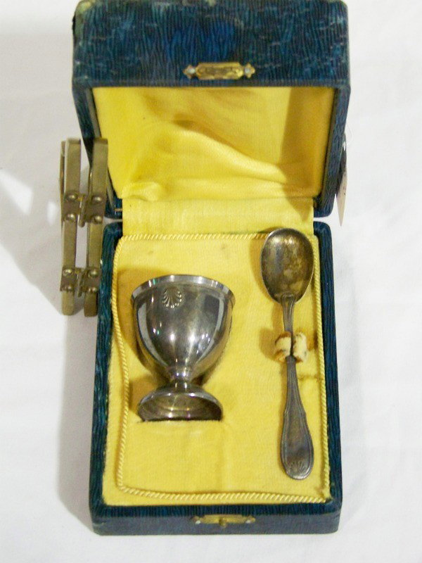 Antique French Hallmarked Silver Cup & Spoon W/ Bo: Antique French Hallmarked Silver Cup & Spoon W/ Box. Both hallmarked and monogramed. Both have shell's. Cup is 2" and spoon is 4 1/2" in original box. Minerva hallmark.