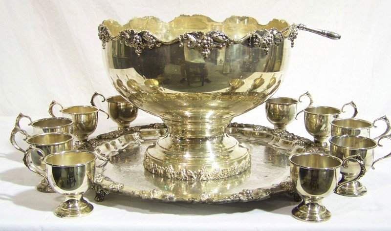 Large Vintage Grape Pattern S/P Punch Bowl , Tray: Large Vintage Grape Pattern S/P Punch Bowl , Tray & 12 cups ( one handle is off a cup ). Has a 21" ornate Platter a 12" tall 16" wide ornate Punch bowl with ladle and 12 cups.